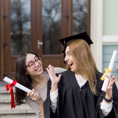 best-friends-graduation-ceremony-outdoors
